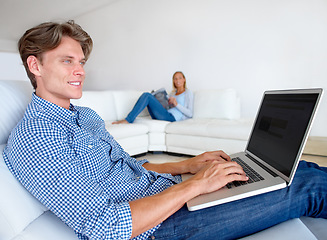 Image showing Happy man, laptop and sofa on mockup screen for remote work, email or networking in relax at home. Male person or freelancer thinking on computer for communication, connectivity or idea on couch