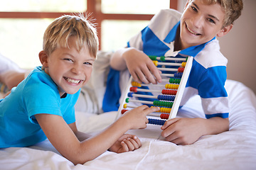 Image showing Children, home and portrait with abacus for learning, happy and bonding together by education toy for math. Brother, smile on face and counting game on bed for sibling love, and development in house