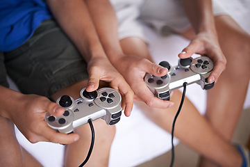 Image showing Children, hands and video game controller in a house for gaming, subscription or entertainment closeup from above. Gamepad, zoom and gamer boy kids at home with esports, competition or challenge
