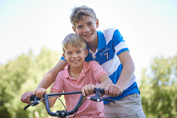 Image showing Nature, happy and portrait of kids on bicycle riding in outdoor field, park or forest for exercise. Smile, cycling and confident young boy children on bike for cardio, hobby or training in a garden.