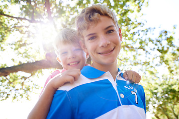 Image showing Piggy back, portrait and boys in a forest, summer and vacation with happiness or bonding together. Fresh air, face or young people in a park or relax with a game and sunshine with lens flare or smile