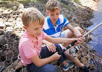 Image showing Children, friends and fishing rod at river for summer holiday at countryside for vacation, learning or travel. Kids, boys and happy for catch adventure at lake for bonding teamwork, teaching or relax