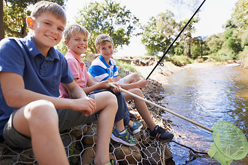 Image showing Children, friends and portrait with fishing rod at river for summer holiday at countryside for vacation, learning or travel. Kids, boys and happy for catch adventure at lake for bonding, sun or relax