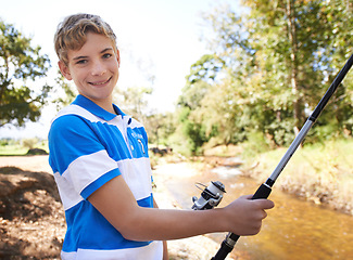 Image showing Child, portrait and fishing rod at river in summer for adventure hobby or sunshine, nature or countryside. Male person, face and equipment for holiday trip at lake for learning, travel or outdoor