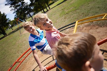 Image showing Children, playground and carousel or park fun together as friends for speed, excitement or fast. Kids, boys and brothers on field for playing game in sunshine for bonding connection, outdoor or joy