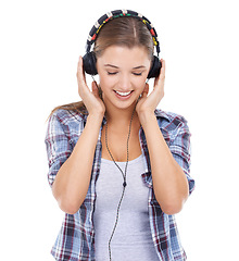 Image showing Woman, headphones and listening to music in studio for audio for streaming entertainment, track or white background. Female person, smile and headset for radio techno, subscription or mockup space