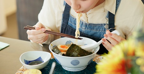 Image showing Hungry woman, eating ramen and restaurant with chopsticks, noodles and lunch for nutrition. Girl, person and meal for health, wellness and diet for wellness at cafeteria, diner and brunch in Tokyo