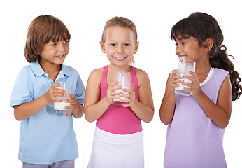 Image showing Children, drink and milk mustache on face with nutrition, health and wellness in white background of studio. Calcium, dairy and kids smile in portrait with benefits in diet for teeth and growth