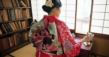 Image showing Window, writing and Japanese woman for traditional script on paper, documents and page in home. Creative, Asian culture and person with vintage paintbrush, ink and tools for calligraphy, font or text