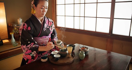 Image showing Japanese, woman and kimono for tea ceremony in Chashitsu room with matcha and traditional custom. Person, temae and vintage style outfit or dress for culture, fashion and honor with antique crockery