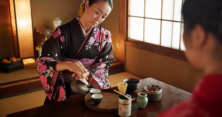 Image showing Japanese, woman and matcha for tea ceremony in Chashitsu room with kimono dress and traditional custom. Person, temae and vintage style outfit for culture, fashion and honor with antique crockery