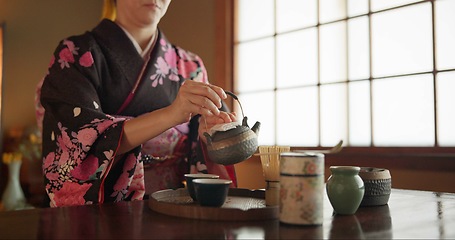 Image showing Japanese, woman and matcha for tea ceremony in Chashitsu room with kimono dress and traditional custom. Person, temae and vintage style outfit for culture, fashion and honor with antique crockery