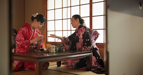 Image showing Traditional, culture and Japanese women with tea in home with herbs, leaves and flavor in teapot. Ritual, indigenous and people with herbal beverage for ceremony, talking and wellness for drinking