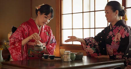 Image showing Traditional, ceremony and Japanese women with tea in home with herbs, leaves and flavor in teapot. Ritual, indigenous and people with herbal beverage for culture, talking and wellness for drinking