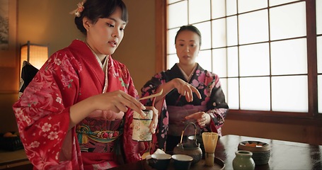 Image showing Culture, teapot and Japanese women with tea in home with traditional herbs, leaves and flavor in home. Ritual, indigenous and people with herbal beverage for ceremony, calm and wellness for drinking
