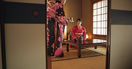 Image showing Japanese, women or matcha tea in kimono for ceremony in Chashitsu room with custom tradition or culture. People, temae and vintage outfit or dress for heritage, respect or pride with serving guest