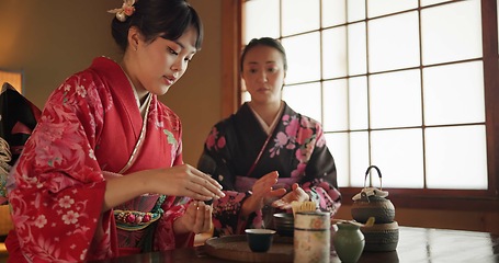 Image showing Japanese, people and kimono for tea ceremony in Chashitsu room with peace or custom tradition. Women, temae and vintage style dress or talking with culture, fashion and friends with antique crockery