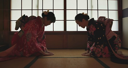 Image showing Japan, women or bow in kimono for greeting in tea ceremony or Chashitsu room for custom tradition. People, temae and vintage style outfit or dress for culture, respect or welcome with pride on floor