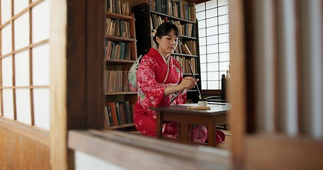 Image showing Painting, Japanese woman and brush with ink, creativity and traditional text with script for paper and Asian writer. Tools, black paint and calligraphy with person at a desk and artistic with hobby