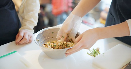Image showing Chef hands, cooking and food in restaurant with bowl, vegetables and prepare ingredients for nutrition. People, working and catering service for diet at cafeteria with meal, dinner or lunch on table