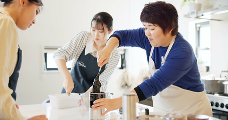 Image showing Cooking class, restaurant and women with Japanese teacher and food in a kitchen learning professional skill. Student, education and Asian cuisine course with people together working on skills