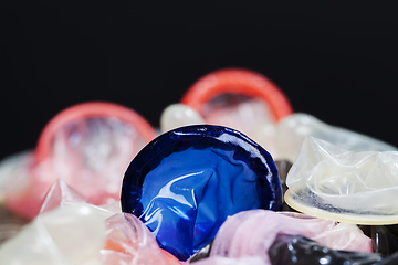 Image showing a whole blue latex condom