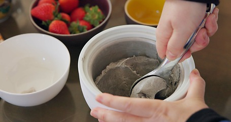 Image showing Hands, ice cream and fruit in kitchen for cooking or preparing dessert on wooden table from above. Food, strawberry or ingredients for recipe with professional culinary chef in restaurant or class