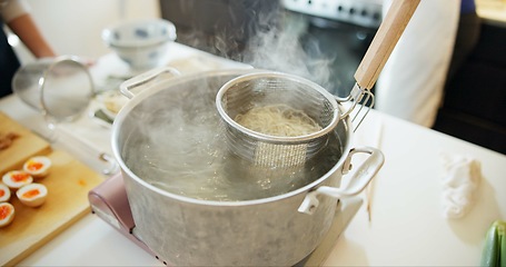 Image showing Cooking, kitchen and Japanese noodles in pot in boiling water for lunch, meal preparation and dinner. Food, cuisine and traditional dish, ingredients and steam for wellness, diet and nutrition