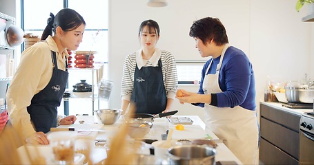 Image showing Japan, chef and cooking in kitchen with teaching for recipe, Japanese cuisine and healthy meal in restaurant. People, women and traditional lunch with learning or instruction for dinner and culture