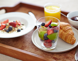 Image showing Wellness, food and closeup of breakfast tray with muesli for balance, benefits or gut health. Fruit, zoom and croissant with vitamins for diet, nutrition or healthy eating, brunch or superfoods salad