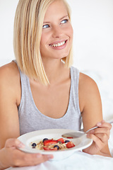 Image showing Woman, thinking and breakfast in bedroom, hotel and wake up for morning hospitality or accommodation. Relax, cereal and holiday with young person in bed with fruit, weekend and comfortable with food