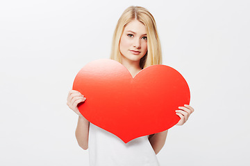 Image showing Woman, portrait and heart or poster mockup or Valentines message, announcement or bulletin. Female person, model and face or white background in studio as love gesture or billboard, placard or banner