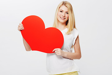 Image showing Woman, portrait and heart or poster mockup as love message, announcement or bulletin. Female person, model and face or white background in studio as valentines gesture or billboard, placard or banner