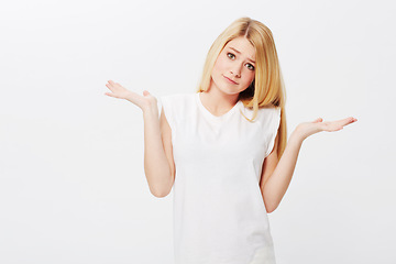 Image showing Space, confused or woman in portrait unsure, doubt or wondering isolated on white background. Person asking, dont know hand gesture or puzzled model with decision, choice or question on studio mockup