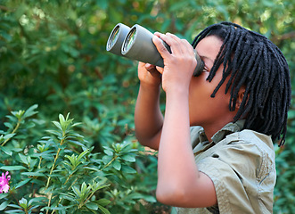 Image showing Nature trees, binocular and black child watch wilderness view on adventure, outdoor exploration or camping trip. Environment, bush leaf and looking kid on sightseeing search in Amazon Rainforest