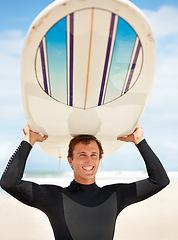 Image showing Surfing, beach and portrait of man with surfboard for water sports training, freedom and fitness outdoors. Nature, happy and person excited for adventure on holiday, vacation and hobby by ocean