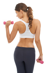 Image showing Fitness, exercise and woman in studio with dumbbell for workout, muscle training and body building. Gym, power and commitment to improvement, strong girl weight lifting on white background from back.