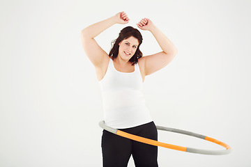 Image showing Happy woman, portrait and hoop workout in fitness, exercise or balance on a white studio background. Active female person smile with plastic circle for training, health and wellness on mockup space