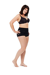 Image showing Portrait, smile and confident plus size woman in underwear in studio isolated on a white background mockup space. Happy person, model and body positivity, health and natural beauty of young girl