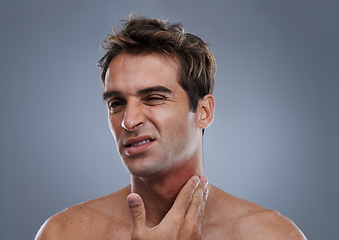 Image showing Man, shave and rash pain from razor burn for hair removal for hygiene maintenance, mistake or grey background. Male person, hand and unhappy in studio or care fail in inflammation, itchy or mockup