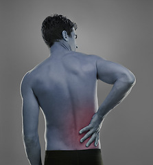 Image showing Man, back pain and spine problem in studio, medical crisis and muscle tension or injury of training. Model, joint ache and sore with inflammation of sport accident and red glow by grey background