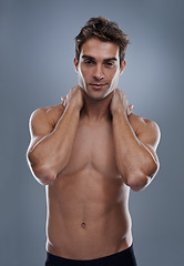 Image showing Man, shirtless and portrait with confidence in studio or grey background with muscles for fitness, wellness or body care. Male person, model and topless with mockup space for stomach, exercise or abs