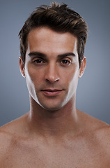 Image showing Portrait, skincare and man with cosmetics, wellness and confident guy on grey studio background. Face, person and model with beauty or grooming with routine or dermatology with healthy skin or glow