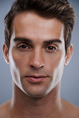 Image showing Portrait, skincare and man with cosmetics, dermatology and confident guy on grey studio background. Face, person or model with beauty or grooming with routine or aesthetic with healthy skin or glow