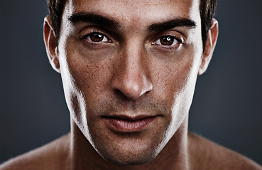 Image showing Portrait, skincare and man with cosmetics, glow and grooming on grey studio background. Person, guy and model with routine or treatment with beauty and shine with beauty, wellness or dermatology