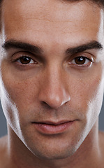 Image showing Portrait, skincare and man with cosmetics, closeup and dermatology on grey studio background. Face, person or model with beauty or grooming with routine or wellness with glow, aesthetic and self care