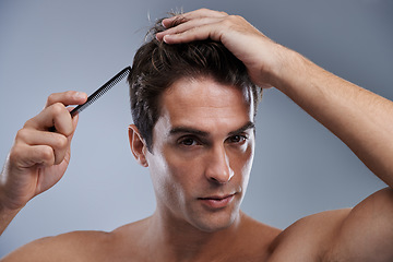 Image showing Man, portrait and comb hair for grooming style on grey background for hygiene, self care and shirtless. Male person, model and face with brush for routine in morning or health, studio or mockup space
