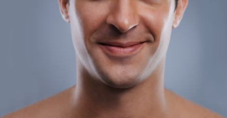 Image showing Man, mouth and smile with skincare and lips with hygiene, jawline and satisfaction with treatment closeup. Grooming, confidence and face with male model in studio background for cosmetic shave