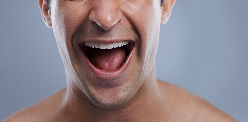 Image showing Man, mouth and clean shave with laughing, lips and hygiene with jawline, satisfaction and treatment closeup. Grooming, confidence and face with male model in studio background for cosmetic smile