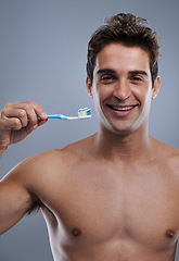 Image showing Portrait, man and smile with toothbrush, oral health and body care on grey studio background. Face, person or model with fresh breath or healthy with toothpaste or morning routine with dental hygiene